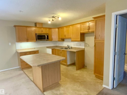 #140 16035 132 St Nw, Edmonton, AB - Indoor Photo Showing Kitchen With Double Sink