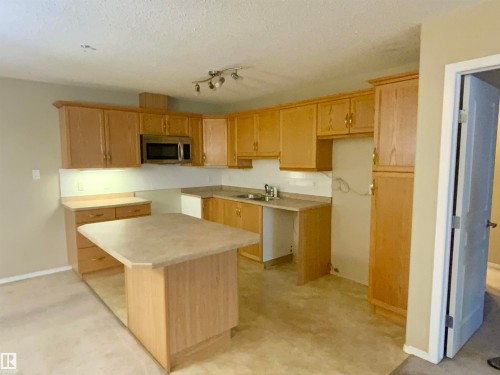 #140 16035 132 St Nw, Edmonton, AB - Indoor Photo Showing Kitchen With Double Sink