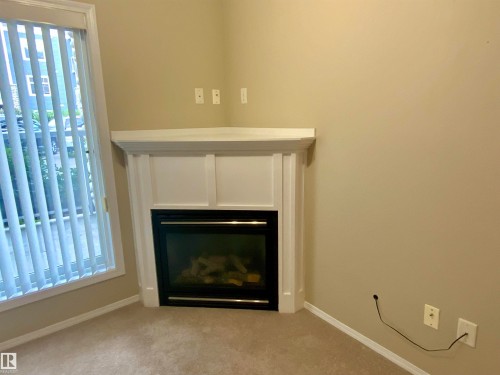 #140 16035 132 St Nw, Edmonton, AB - Indoor Photo Showing Living Room With Fireplace