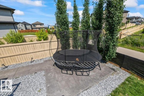 Gravel landscaping with a concrete patio - 5203 23A Avenue Sw, Edmonton, AB - Outdoor
