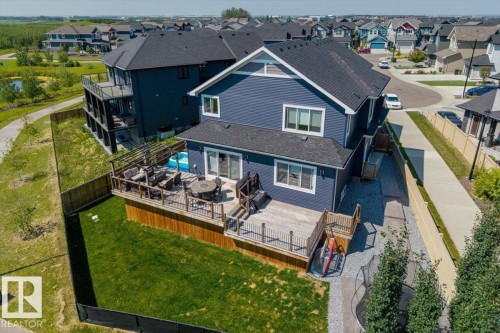 Two-story residence with blue siding, a dark shingled roof, and white window trim - 5203 23A Avenue Sw, Edmonton, AB - Outdoor