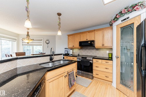 2727 Miles Place Sw, Edmonton, AB - Indoor Photo Showing Kitchen With Double Sink