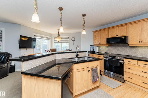 2727 Miles Place Sw, Edmonton, AB - Indoor Photo Showing Kitchen With Double Sink