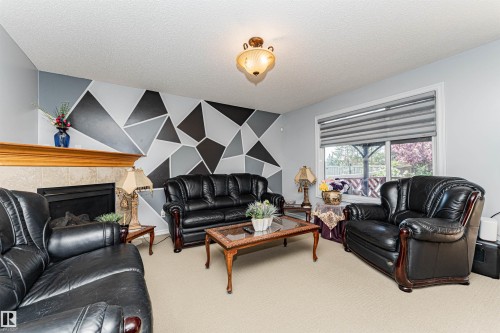 2727 Miles Place Sw, Edmonton, AB - Indoor Photo Showing Living Room With Fireplace
