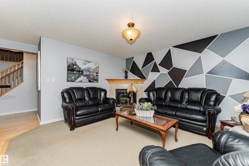 2727 Miles Place Sw, Edmonton, AB - Indoor Photo Showing Living Room With Fireplace