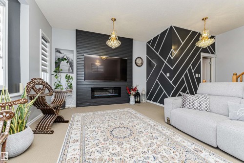 2727 Miles Place Sw, Edmonton, AB - Indoor Photo Showing Living Room With Fireplace