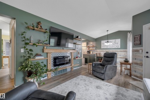 #62 4410 52 Ave, Wetaskiwin, AB - Indoor Photo Showing Living Room With Fireplace