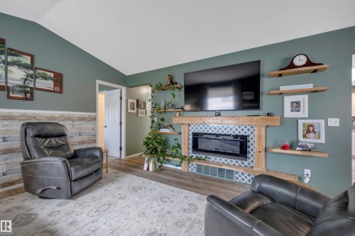 #62 4410 52 Ave, Wetaskiwin, AB - Indoor Photo Showing Living Room With Fireplace