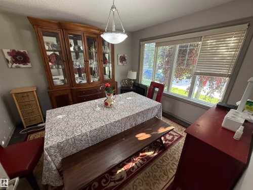 Recessed ceiling lighting and large windows with blinds - 7065 Cardinal Way Sw, Edmonton, AB - Indoor