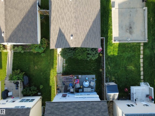 Rear property featuring a deck, concrete patio, and fenced perimeter - 7065 Cardinal Way Sw, Edmonton, AB - Outdoor