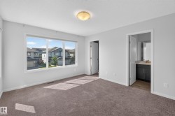 Bright interiors with neutral wall tones, plush carpeting, and a flush mount ceiling fixture - 