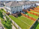 Spacious backyard featuring a wood deck with stairs, a sliding glass door entry, and a full wood privacy fence - 1404 25 Avenue Nw, Edmonton, AB  - Outdoor With Exterior 