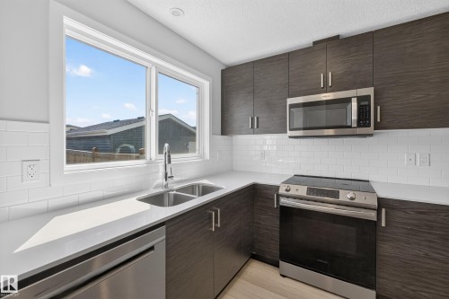 749 Southfork Drive, Leduc, AB - Indoor Photo Showing Kitchen With Double Sink