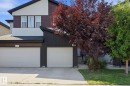 Contemporary exterior featuring a mix of siding materials, a single attached garage, and a concrete driveway. - 1793 Keene Crescent Sw, Edmonton, AB 