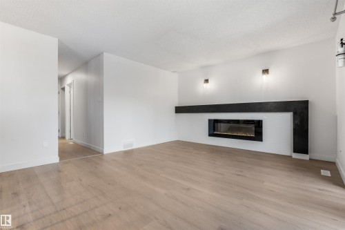 10612 10 Avenue Nw, Edmonton, AB - Indoor Photo Showing Living Room With Fireplace