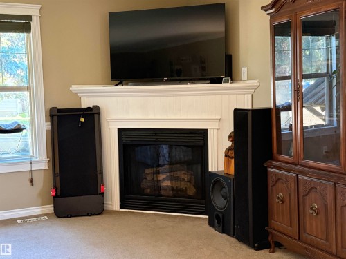 153 Maple Crescent, Wetaskiwin, AB - Indoor Photo Showing Living Room With Fireplace