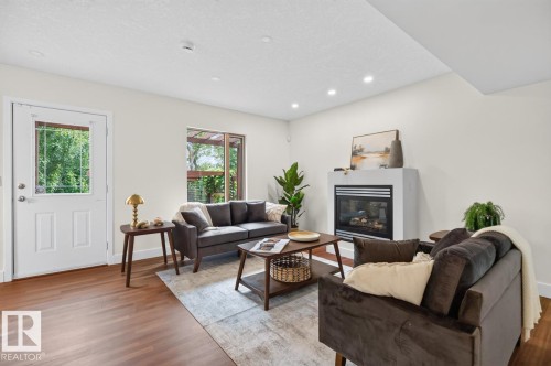 8860 93 Street Nw, Edmonton, AB - Indoor Photo Showing Living Room With Fireplace