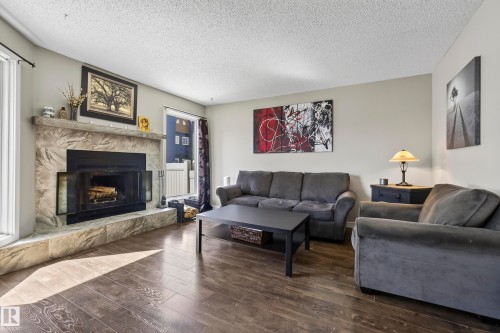 3522 42 Street Nw, Edmonton, AB - Indoor Photo Showing Living Room With Fireplace