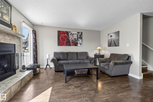 3522 42 Street Nw, Edmonton, AB - Indoor Photo Showing Living Room With Fireplace