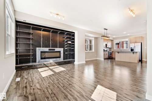 #82 2803 James Mowatt Trail Sw, Edmonton, AB - Indoor Photo Showing Living Room With Fireplace