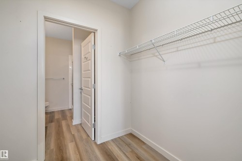 White wire shelving - #207 304 Amblside Li Sw Sw, Edmonton, AB - Indoor With Storage
