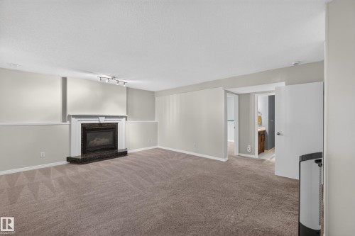 2 Woodside Crescent, Spruce Grove, AB - Indoor Photo Showing Other Room With Fireplace