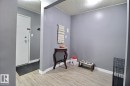 Wood-finish flooring with white trim and a neutral paint palette - #304 14004 26 St Nw, Edmonton, AB  - Indoor 