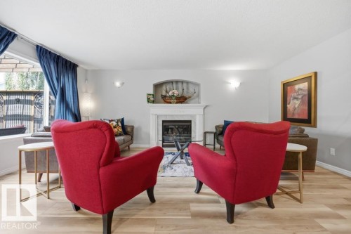 22 Bonin, Beaumont, AB - Indoor Photo Showing Living Room With Fireplace