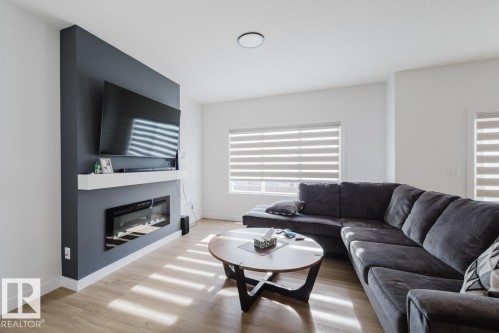 6411 27 Avenue Sw, Edmonton, AB - Indoor Photo Showing Living Room With Fireplace