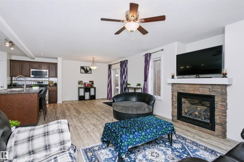 4120 50 Street, Gibbons, AB - Indoor Photo Showing Living Room With Fireplace