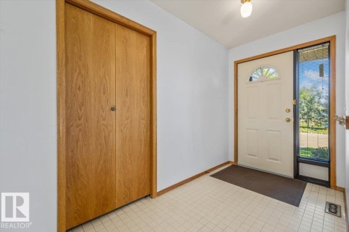 Entryway featuring light-toned square tile flooring - 4427 Payne Avenue, Onoway, AB - Indoor Photo Showing Other Room
