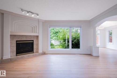 310 Livingstone Court Nw, Edmonton, AB - Indoor Photo Showing Living Room With Fireplace