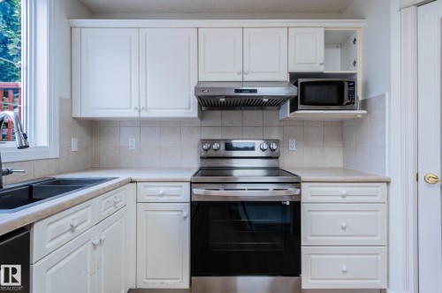 310 Livingstone Court Nw, Edmonton, AB - Indoor Photo Showing Kitchen With Double Sink