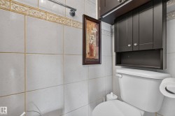 White square tile walls with decorative border - 