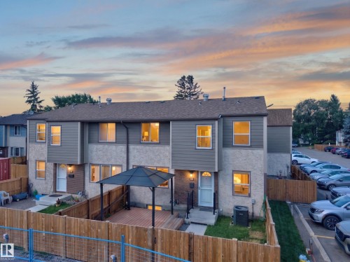 Two-story property featuring a multi-material exterior, private rear deck with gazebo, and a fenced yard - 23 Willowdale Place Nw, Edmonton, AB 
