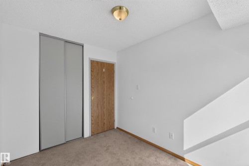 Wall-to-wall carpeting and neutral wall finishes - 23 Willowdale Place Nw, Edmonton, AB 