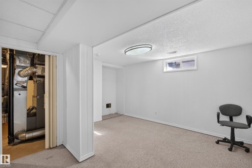 Carpeted flooring with white painted walls and ceiling - 23 Willowdale Place Nw, Edmonton, AB 