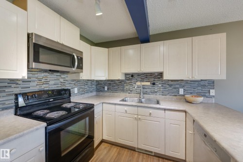 13086 162A Avenue Nw, Edmonton, AB - Indoor Photo Showing Kitchen With Double Sink