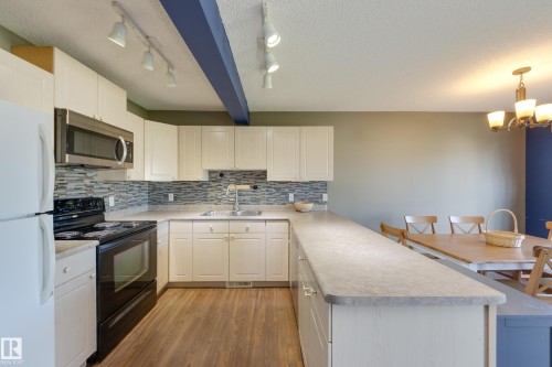 13086 162A Avenue Nw, Edmonton, AB - Indoor Photo Showing Kitchen With Double Sink