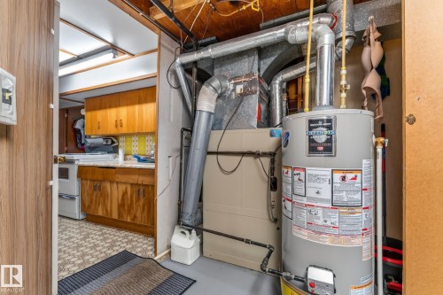 Utility area featuring a water heater and furnace unit - 13432 134 Street Nw, Edmonton, AB - Indoor Photo Showing Basement