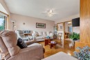 Hardwood flooring, ceiling fan, and framed doorways - 13432 134 Street Nw, Edmonton, AB  - Indoor Photo Showing Living Room 