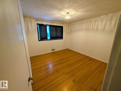 Hardwood flooring, painted walls, window with blinds, ceiling-mounted light fixture - 