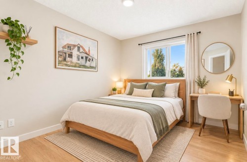 Wood-finish flooring, single window with roller shade, built-in floating shelf, and recessed lighting - 21207 90 Ave Nw, Edmonton, AB - Indoor Photo Showing Bedroom