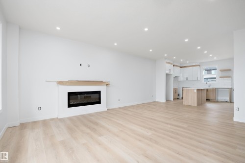 525 Robinson Boulevard, Leduc, AB - Indoor Photo Showing Living Room With Fireplace
