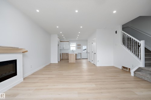 525 Robinson Boulevard, Leduc, AB - Indoor Photo Showing Living Room With Fireplace