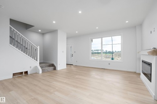 525 Robinson Boulevard, Leduc, AB - Indoor With Fireplace