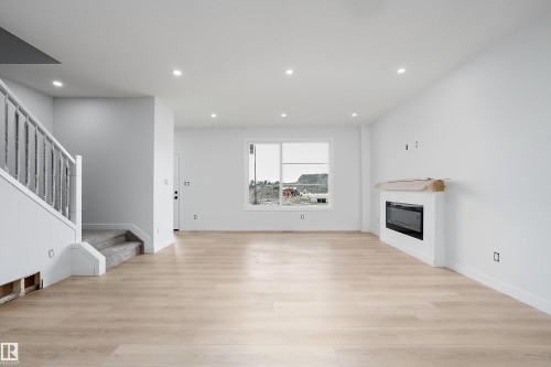 525 Robinson Boulevard, Leduc, AB - Indoor With Fireplace