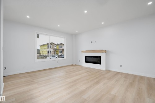525 Robinson Boulevard, Leduc, AB - Indoor Photo Showing Living Room With Fireplace