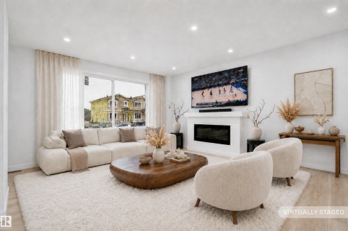 525 Robinson Boulevard, Leduc, AB - Indoor Photo Showing Living Room With Fireplace