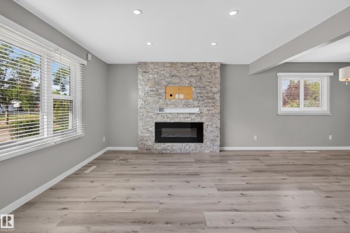 7108 90 Avenue Nw, Edmonton, AB - Indoor Photo Showing Living Room With Fireplace